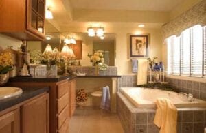 A bathroom with cabinets and a bathtub