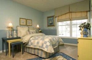 A bedroom with blue walls